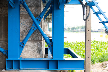 Steel frame scaffolding at the bridge renovation work on the river