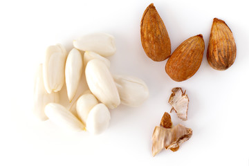 row, line of peeled young almonds on a white background, isolate, nut antioxidant