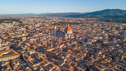 Aerial drone shot view of Florence with main attractions in the morning sunlight