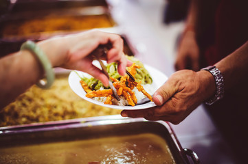 Food donation to the poor in human society : the concept of helping each other