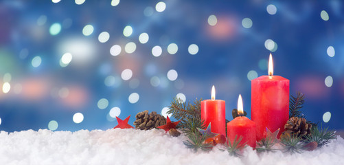 Red candles on snow, Christmas card