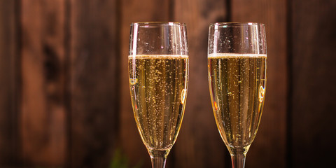 champagne in transparent glasses and a bottle (New Year's atmosphere, Christmas) happy holidays! top. food background. copy space