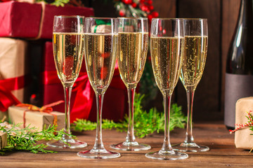champagne in transparent glasses and a bottle (New Year's atmosphere, Christmas) happy holidays! top. food background. copy space
