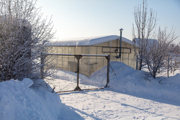 Gates in the garden in the snow