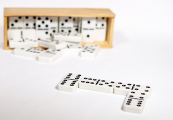 Fototapeta na wymiar Dominoes in Wooden Box on white background