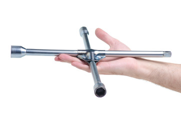 Cross wheel wrench in hand on white background isolation