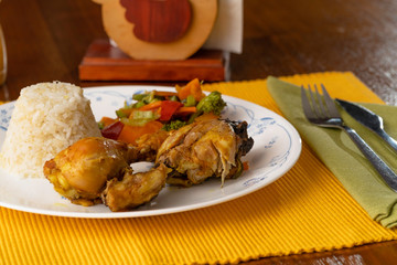 boiled chicken with curry, served with rice mixed with quinoa and boiled vegetables