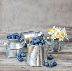 Obraz na płótnie Canvas Blueberries in a metal tableware