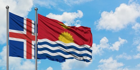 Iceland and Kiribati flag waving in the wind against white cloudy blue sky together. Diplomacy concept, international relations.
