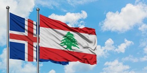 Iceland and Lebanon flag waving in the wind against white cloudy blue sky together. Diplomacy concept, international relations.