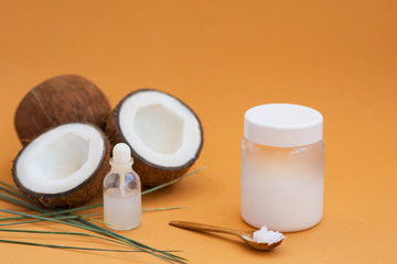 coconut oil on a poor background with coconut fruit for cosmetology and skin hydration