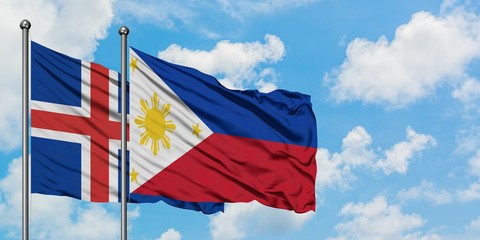 Iceland and Philippines flag waving in the wind against white cloudy blue sky together. Diplomacy concept, international relations.