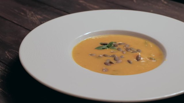 Eating a gourmet cream pupmkin soup