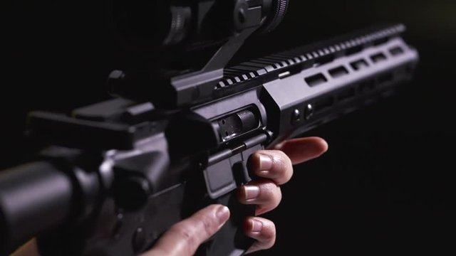 Automatic rifle gun ing to aim and fire at the range, closeup