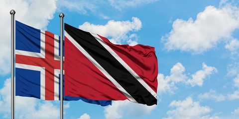 Iceland and Trinidad And Tobago flag waving in the wind against white cloudy blue sky together. Diplomacy concept, international relations.