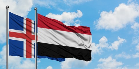 Iceland and Yemen flag waving in the wind against white cloudy blue sky together. Diplomacy concept, international relations.