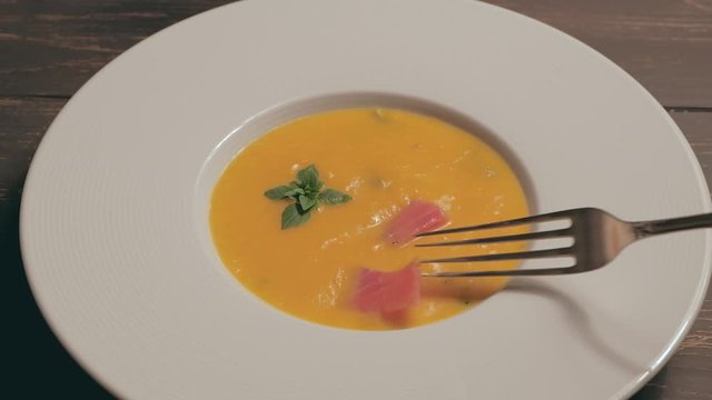 Pumpkin soup with sliced salmon