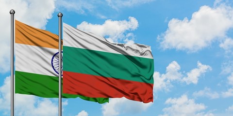 India and Bulgaria flag waving in the wind against white cloudy blue sky together. Diplomacy concept, international relations.