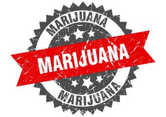 marijuana grunge stamp with red band. marijuana