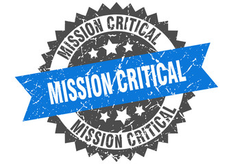 mission critical grunge stamp with blue band. mission critical