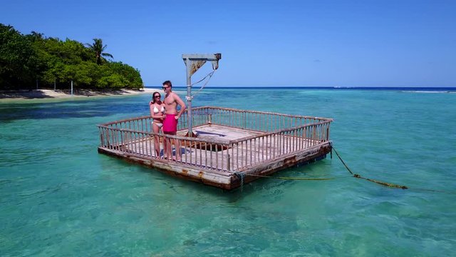 Young couple experiencing great moments from holidays on beautiful coast of tropical island in Thailand