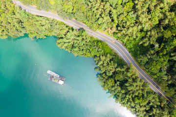 road in forest with a boat at Sun Moon Lake
