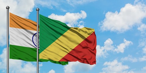 India and Republic Of The Congo flag waving in the wind against white cloudy blue sky together. Diplomacy concept, international relations.