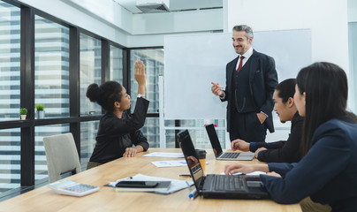 African American business woman raising hand asking her boss while meeting with colleagues in office.Business Team Meeting Presentation,Conference Planning Business Concept