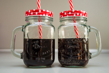 sweet carbonised soft drink in the glass isolated on grey background