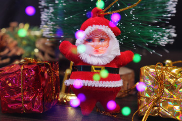 Obraz premium Colorful Christmas-tree decorations for Christmas and New Year, artificial Christmas tree and blinking multi-colored garlands.