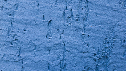 Beautiful blue wall texture close up with plaster, good construction background. Horizontal