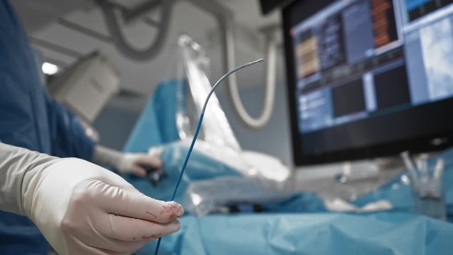 Surgeon uses navigation catheter of medical robotic magnetic system. Close-up