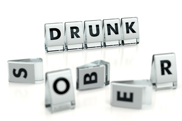 DRUNK word written on glossy blocks and fallen over blurry blocks with SOBER letters. Isolated on white. One of the most destructive addictions - concept for articles, magazines, blogs. 3D rendering