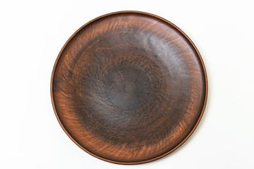 Clay utensils, a plate of clay on a white background. Top view. Close-up.