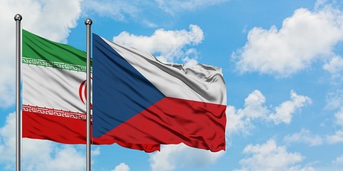 Iran and Czech Republic flag waving in the wind against white cloudy blue sky together. Diplomacy concept, international relations.