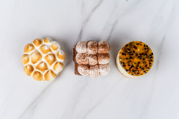 Mini chocolate, lemon pie and passion fruit cake.