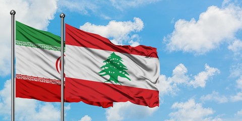 Iran and Lebanon flag waving in the wind against white cloudy blue sky together. Diplomacy concept, international relations.