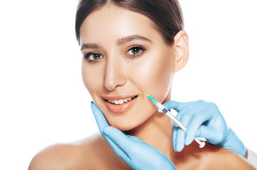Smiling woman received procedure lifting skin. beauty injections into female face isolated on white