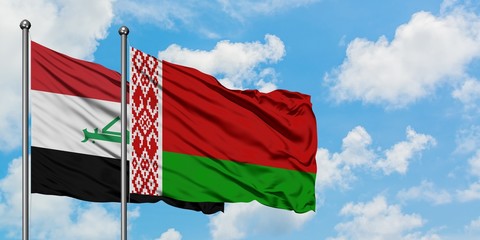 Iraq and Belarus flag waving in the wind against white cloudy blue sky together. Diplomacy concept, international relations.