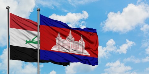 Iraq and Cambodia flag waving in the wind against white cloudy blue sky together. Diplomacy concept, international relations.