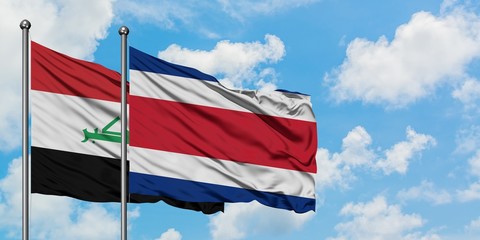 Iraq and Costa Rica flag waving in the wind against white cloudy blue sky together. Diplomacy concept, international relations.