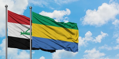 Iraq and Gabon flag waving in the wind against white cloudy blue sky together. Diplomacy concept, international relations.