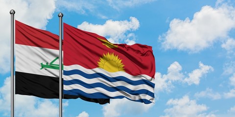 Iraq and Kiribati flag waving in the wind against white cloudy blue sky together. Diplomacy concept, international relations.