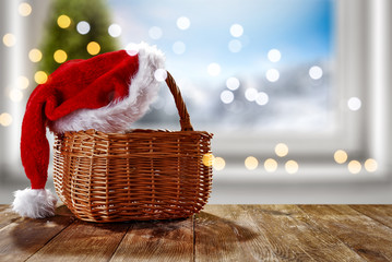 Table background of free space for your decoration and winter window background.Christmas tree.Winter landscape of mountains. Blurred lights.Copy space. 