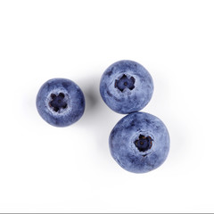 Three blueberries isolated on white with clipping path. Top view