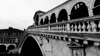 Fototapeta na wymiar Black and white photo of Rialto Bridge taken in the beautiful city of Venice, Italy