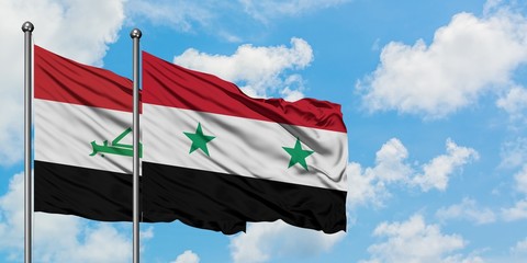 Iraq and Syria flag waving in the wind against white cloudy blue sky together. Diplomacy concept,...