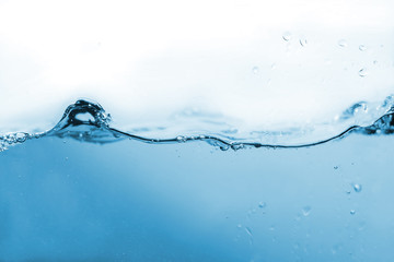 Water splash or water wave with bubbles of air on the background.