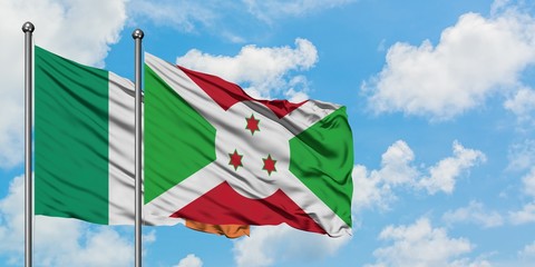 Ireland and Burundi flag waving in the wind against white cloudy blue sky together. Diplomacy concept, international relations.