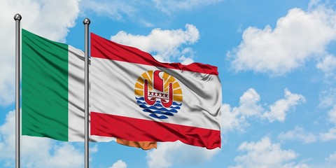 Ireland and French Polynesia flag waving in the wind against white cloudy blue sky together. Diplomacy concept, international relations.